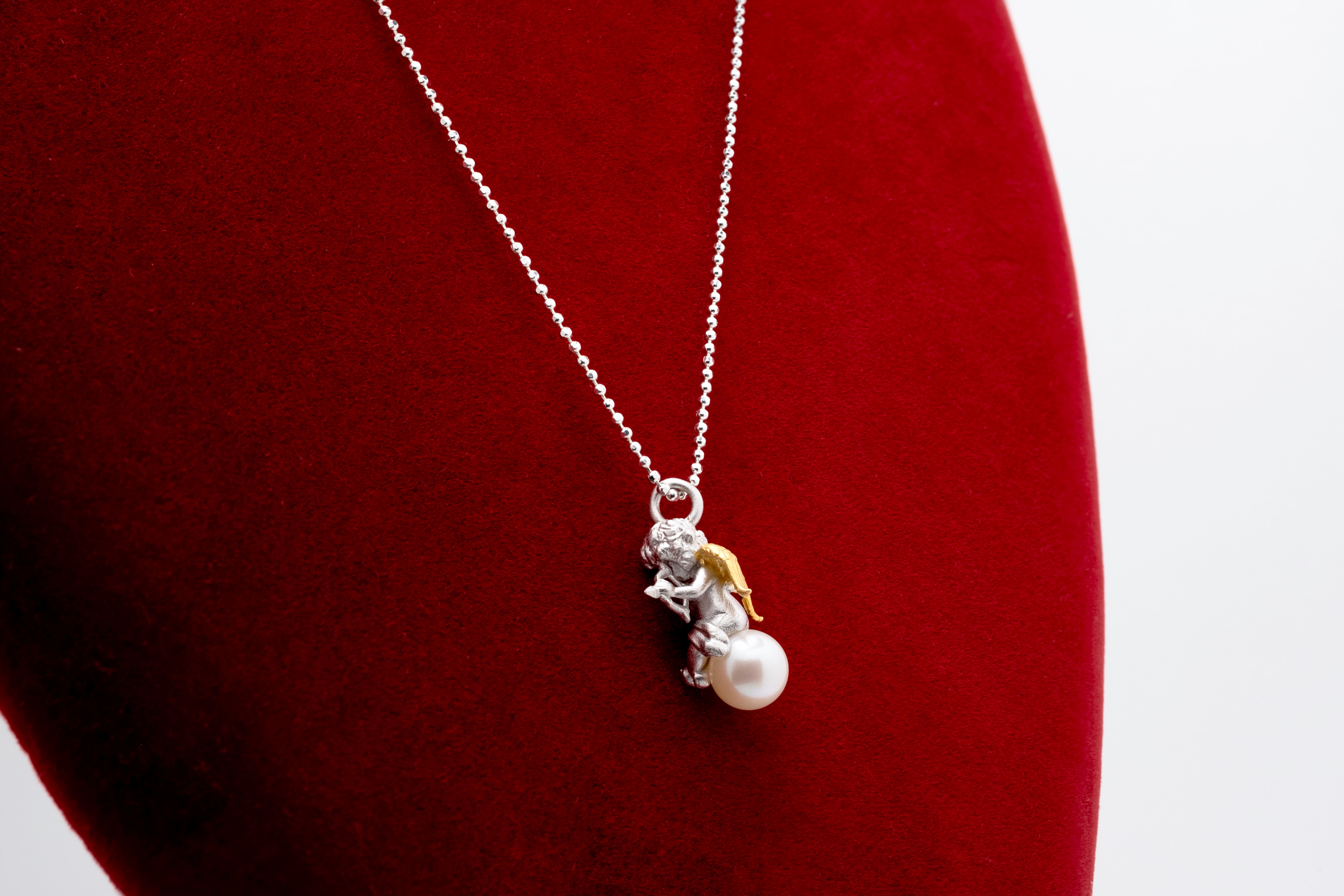 Celestial Melody: Silver Cherub & Pearl Pendant Necklace