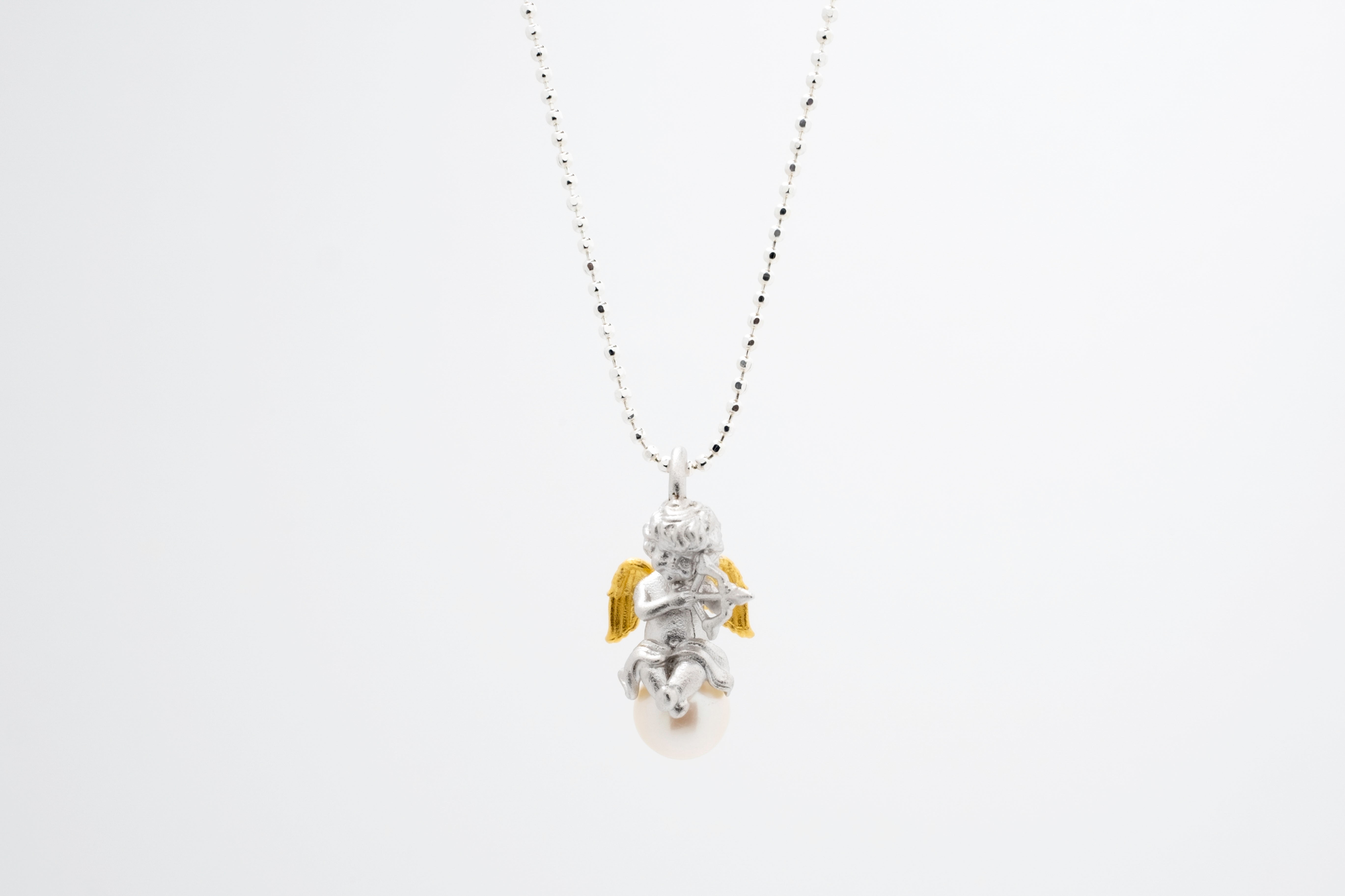 Celestial Melody: Silver Cherub & Pearl Pendant Necklace